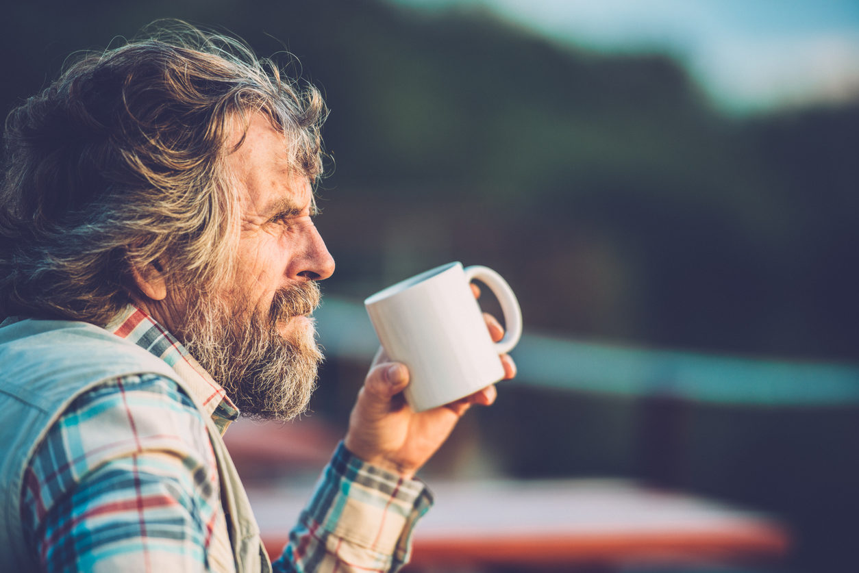 Senior Man Drinking a Coffee or a Tea Outdoors, Close-up